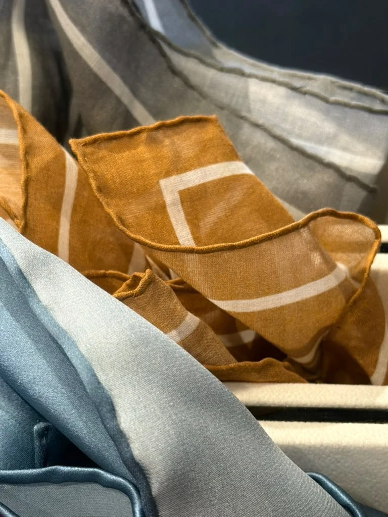 Blue, gold, and gray pocket squares at Modern Suit & Dress