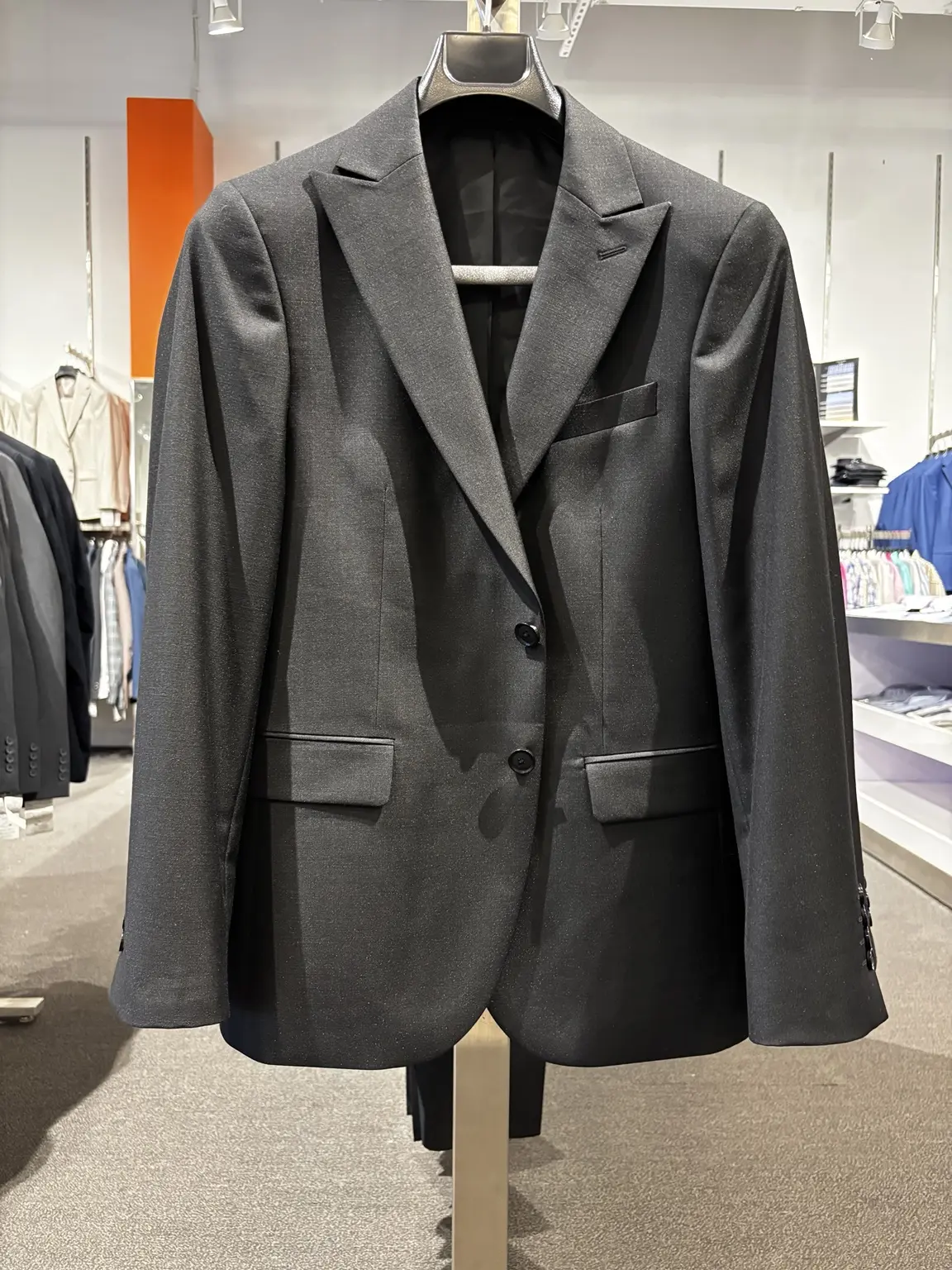 Black suit jacket displayed in the Modern Suit & Dress store