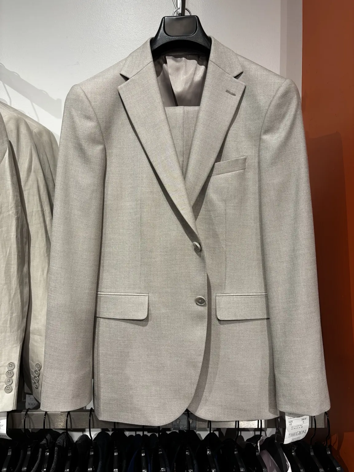 Light gray suit displayed in the Modern Suit & Dress store