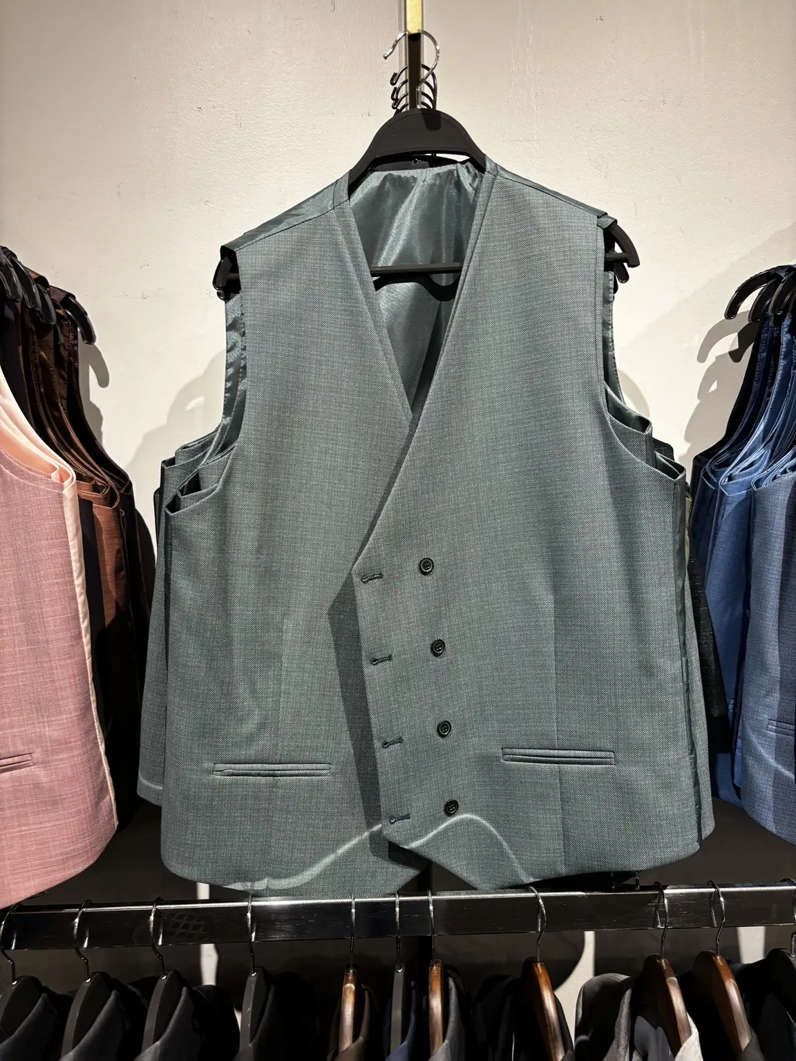 Green suit vest displayed in the Modern Suit & Dress store