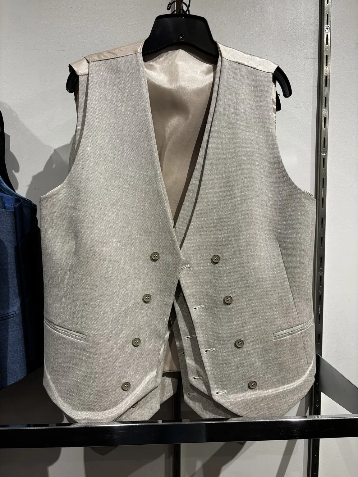 Tan double-breasted vest displayed in the Modern Suit & Dress store