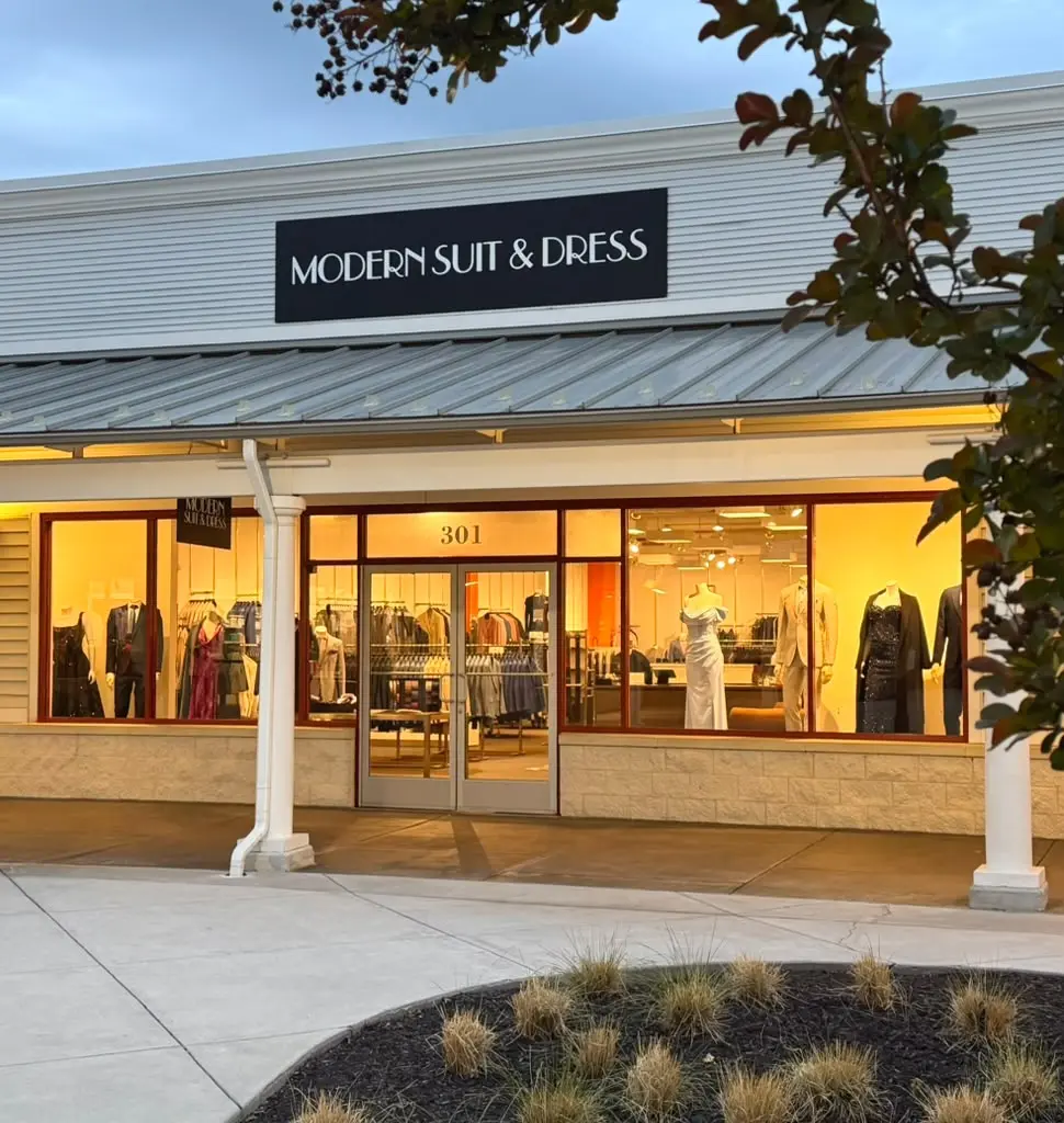 Modern Suit & Dress sign, Suite 301 entrance, windows, and illuminated interior